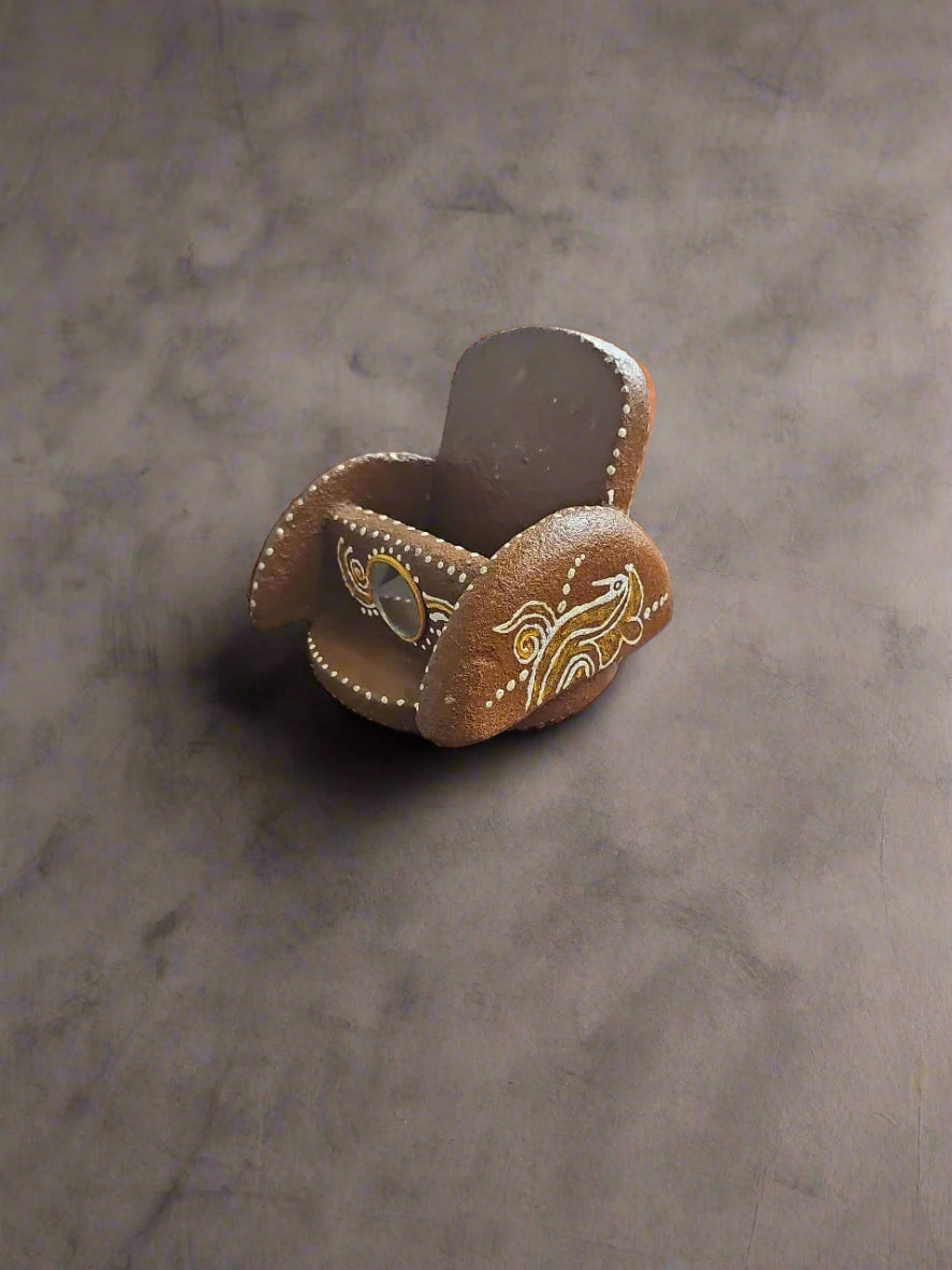 Decorative wooden item with intricate carvings on a black background