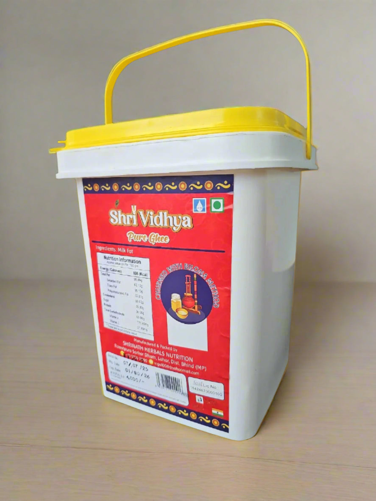 White container with a red label featuring 'Shri Vidhya' on a black background